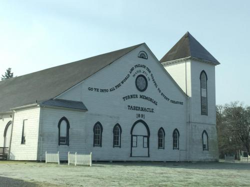 30: The Turner Tabernacle, a large building with a tower at the right corner. The remains of the second tower can be seen on the left corner.