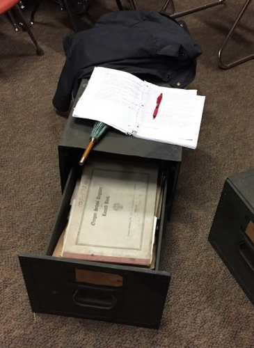 10. Image is a chest with an open drawer. On top of the chest is my open notebook and pen; in the drawer the 1925 record book is visible.