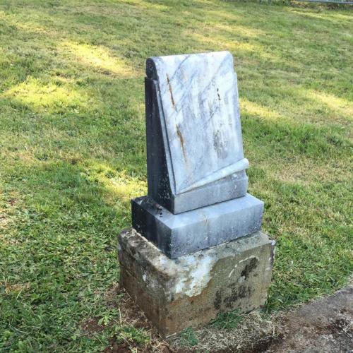 2. Location: Twin Oaks Cemetery, Turner, Oregon. Image: Upright headstone carved to look as though a scroll is unfurling from top to bottom. Text says: In loving remembrance of Mary S, wife of C F Durfee, born May 24 1842, died Feb 1 1907.
