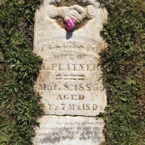 1. Location: Twin Oaks Cemetery, Turner, Oregon. Image: A memorial stone laid flat into the grass which reads: FELICIA H, wife of H. Platner, Mar. 8 1885, Aged 35 y's, 7 m's, 18 d's. shed not for her the bitter tear, nor give the heart to fond regret, tis but the casket that lies here, the gem that fills it sparkles yet. 