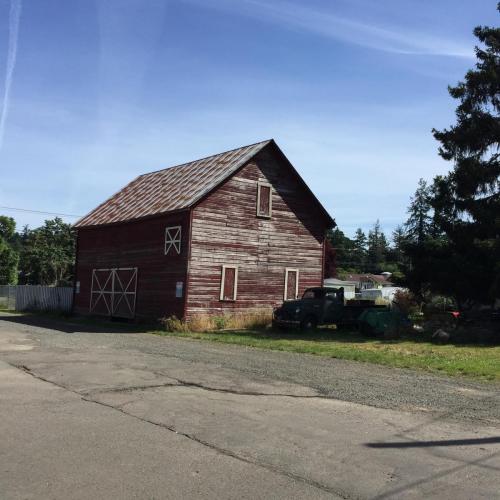 17. Image of a weathered, rust-red old building.